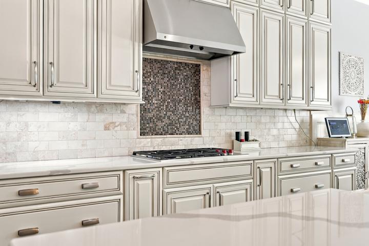 Professional-grade range beneath a stainless statement hood