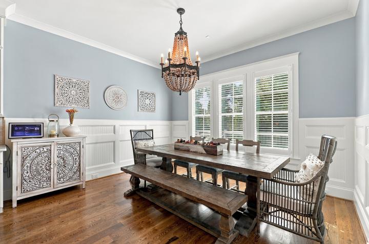 Formal dining room with wainscoting and beaded chandelier