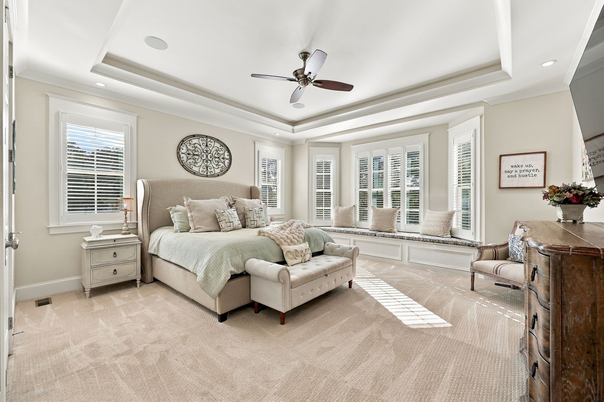 Primary suite with tray ceiling and cove lighting